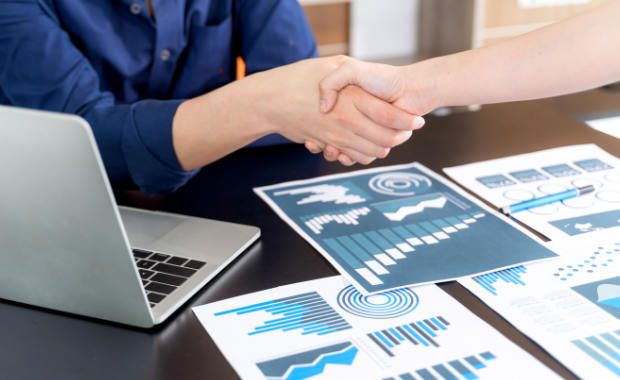 Selective focus young man handshake with someone at office